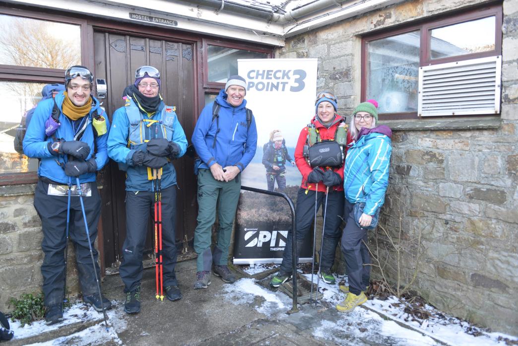 CHECKING IN: Spine Race support worker Claire Cook and media officer Alan Hinkes with athletes Kate Farley, Andy Arnold and Martin Kennedy at the Langdon Beck YHA checkpoint TM pic