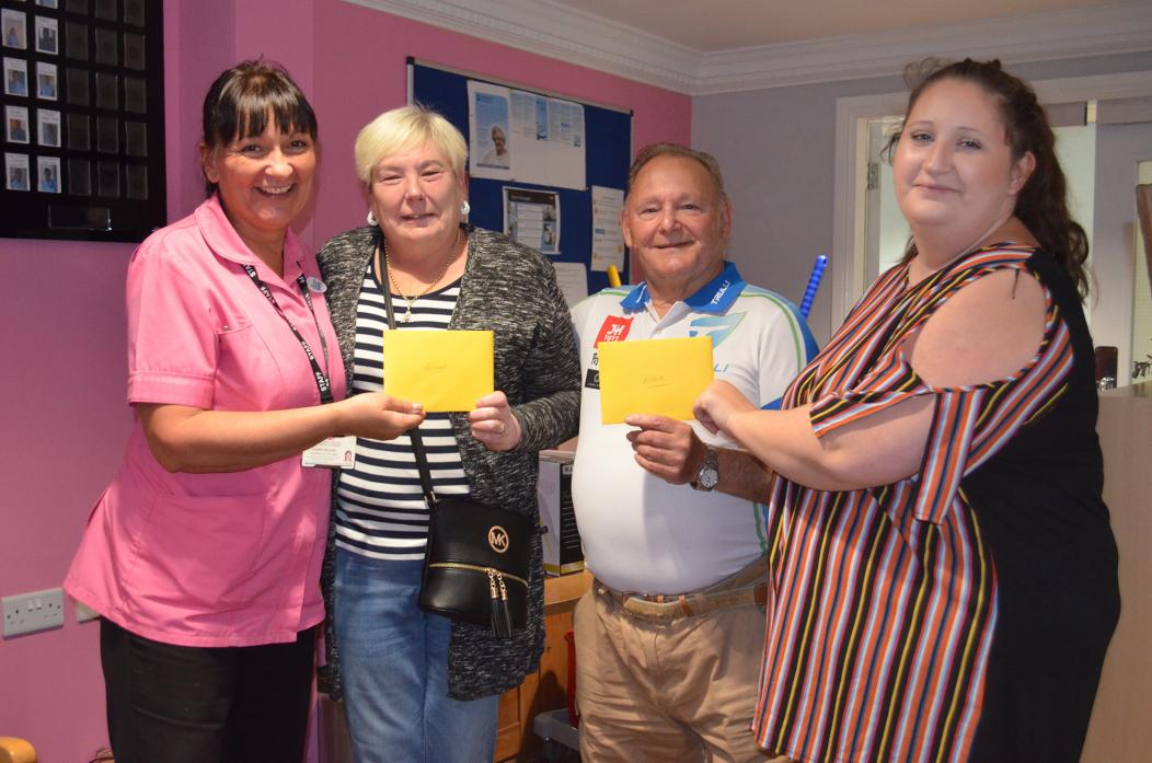 GIVING BACK: Evenwood residents Alison Stoker and Ernie Malt each received a £100 donation for their efforts in the community from staff at Lyons Court care home TM pic