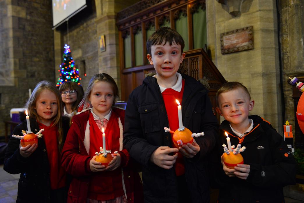 April Watters, Nikita Bowman, Oliver Horley and Tommy Hoggs with their Christingles