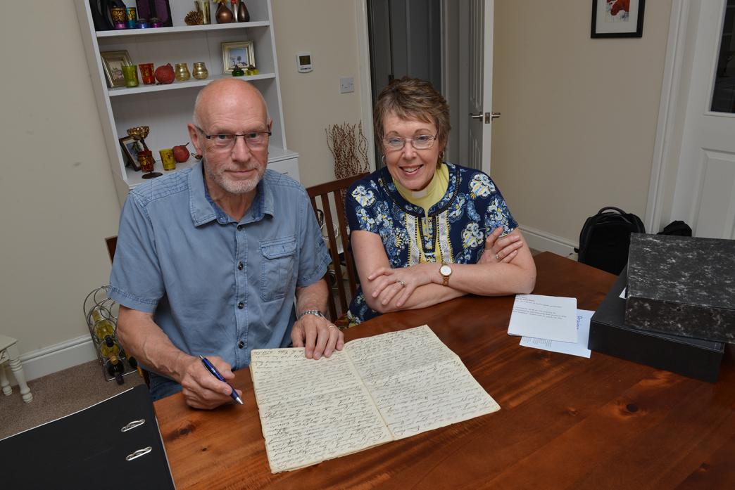 STILL GOING: John Miller and Revd Alison Wallbank look over the original documents from 1729 that led to the formation of Middleton-in-Teesdale Educational Foundation