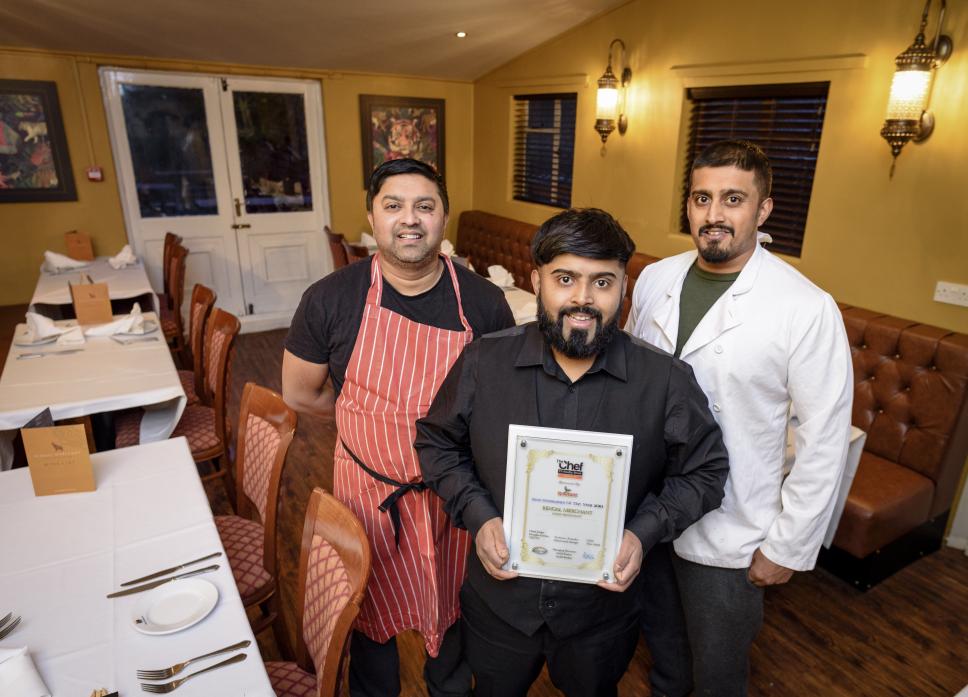 AWARD HONOUR: Brothers  Mufti, Mo  and Naz Choudhury with the award which they say is reward for all their hard work