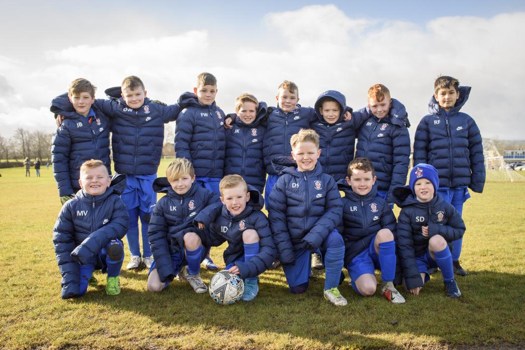 THANK YOU: Some of the under-9s in their new coats before their victory against Billingham on Sunday