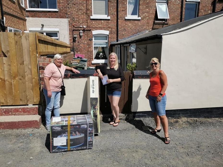 OUR HERO: Kim Clark was reduced to tears when she was surprised with gifts purchased by a collection to show appreciation. She is pictured with Alison Stoker, left, and Sarah Linsley-Patton