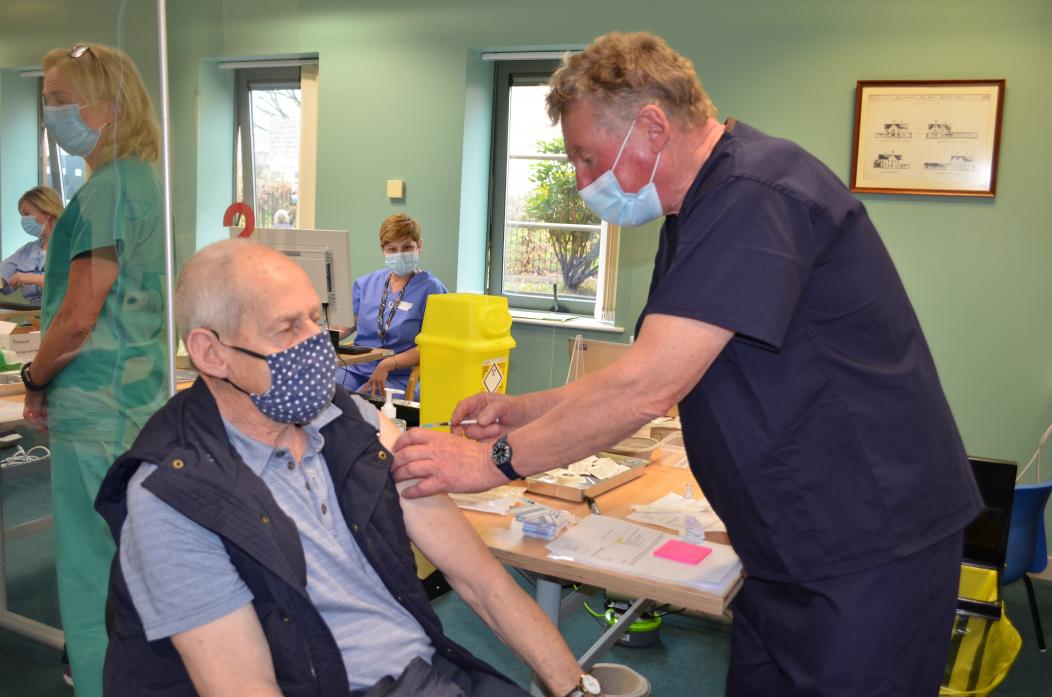 Retired GP Dr John White returned to help with the massive programme. He is seen here administering the jab to Bowes resident Alan Brown.