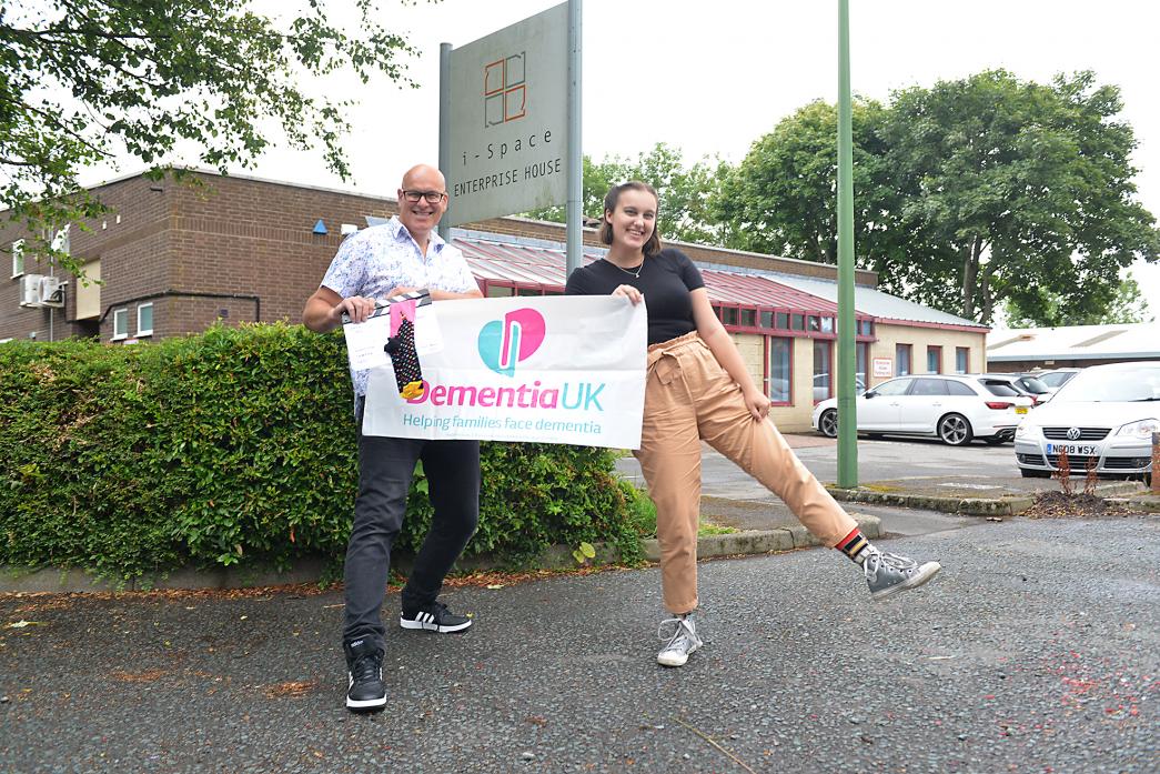 SOCKS APPEAL: Father and daughter team Chris and Issy Howell are wearing “jazzy socks” as a way to raise cash for Dementia UK