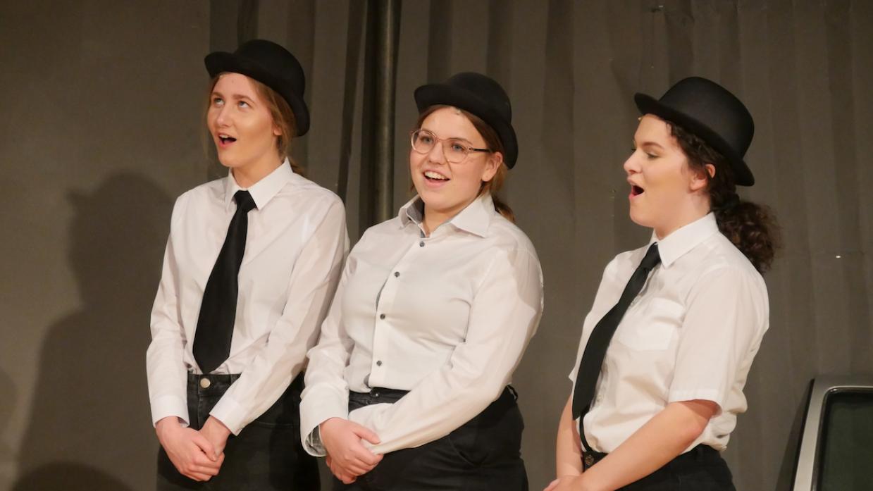 SOMETHING TO SING ABOUT: Imogen Roff, Emma Hardy and Grace Robinson, on stage in a school production