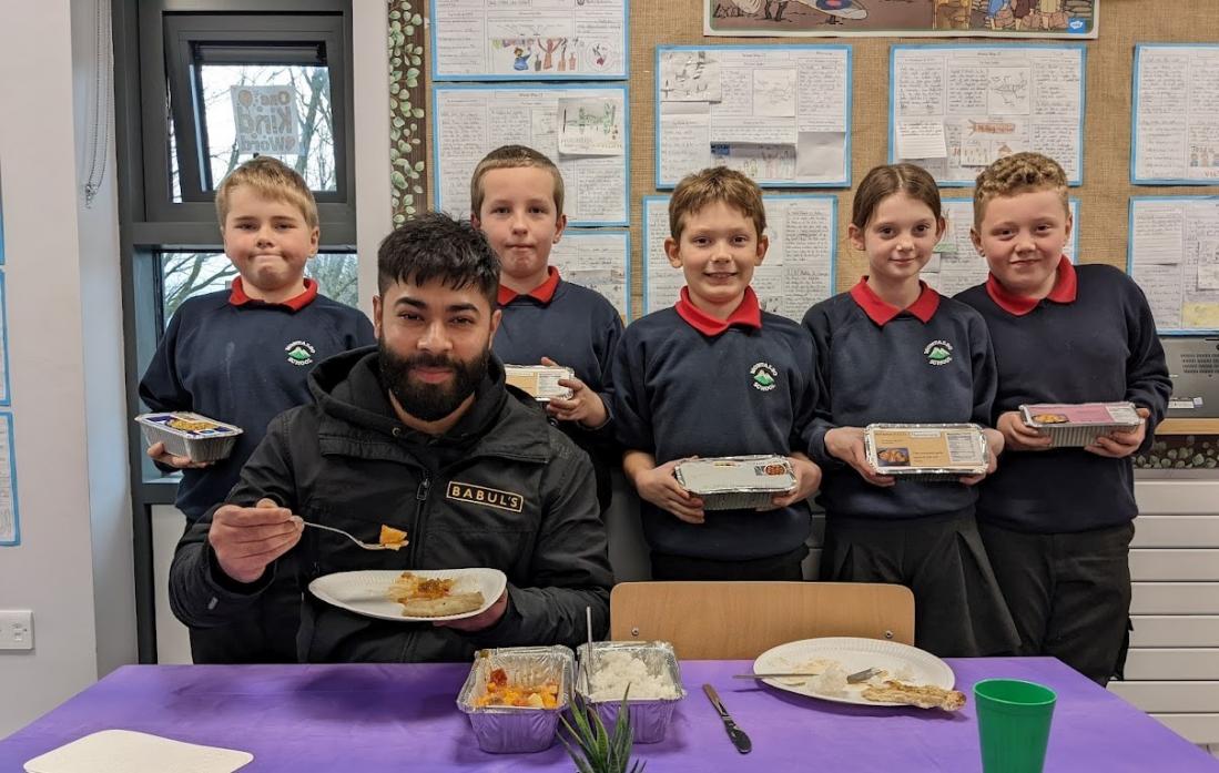 GREAT TASTE: Zak Ahmed with pupils at Montalbo