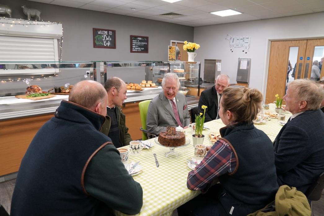 ALL SMILES: Princes Charles enjoys a joke with hill farmers. To the prince’s left is Utass project manager Bob Danby and sitting opposite is farmers’ liaison officer Richard Betton