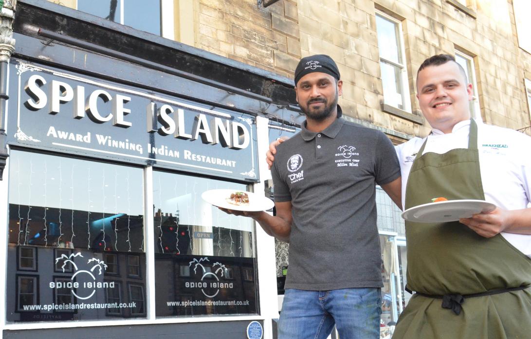 COOKING UP A STORM: Milon Miah, from Spice Island, with Tom Maine, head chef at the Black Bull, Moulton