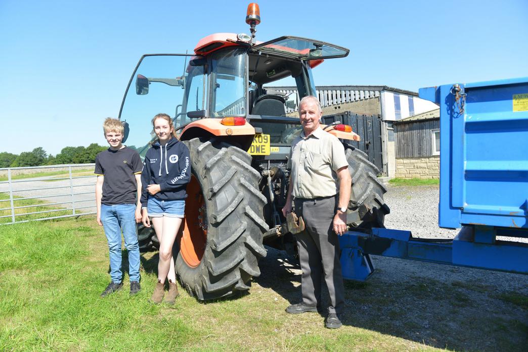 REVVING UP: Joseph Kirkup and Grace Turnbull with trainer Terry Maw during the Lantra 13-15 Tractor Driving Course