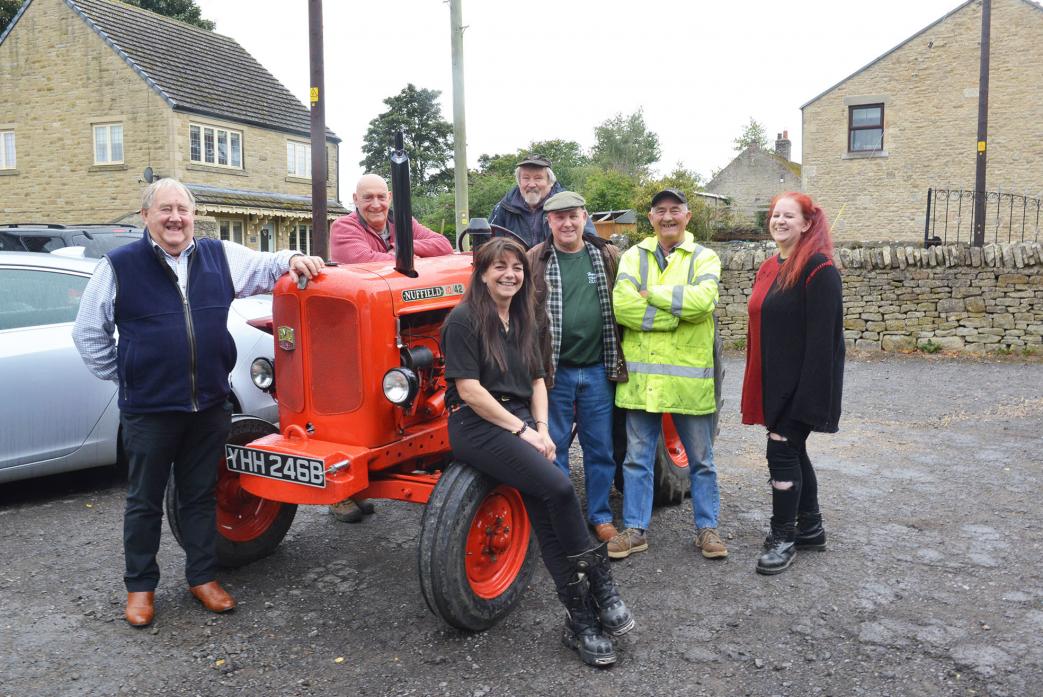 VINTAGE FUN: Tractor Boys Tim Elstob, Michael Armstrong, Brian Bell, Bob Lee and Tommy Lee with Debbie Wrigglesworth and Gayle Fidler from Hamsterley Social Club