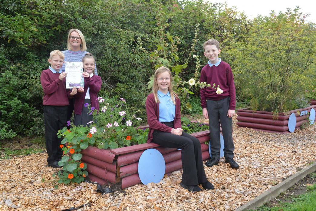 BLOOMING MARVELLOUS: Headteacher Sian Atkinson with pupils Rhys, Libby, Caitlin and Nathan who attended the Northumbria-in-Bloom Awards ceremony