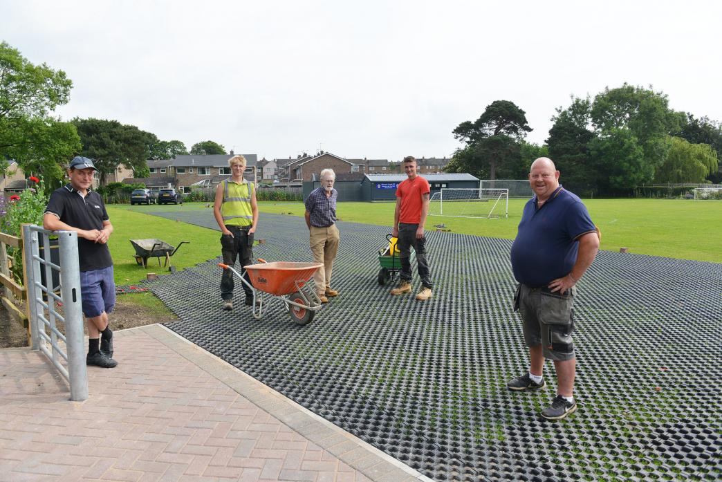 PARKING BOOST: Contractors Anthony Bryce, Alfie Taylor and Callum Perks with garden enthusiast Robert Furness and groundskeeper Geoff Thwaites at the newly constructed car park at Barnard castle FC’s Tens Field grounds