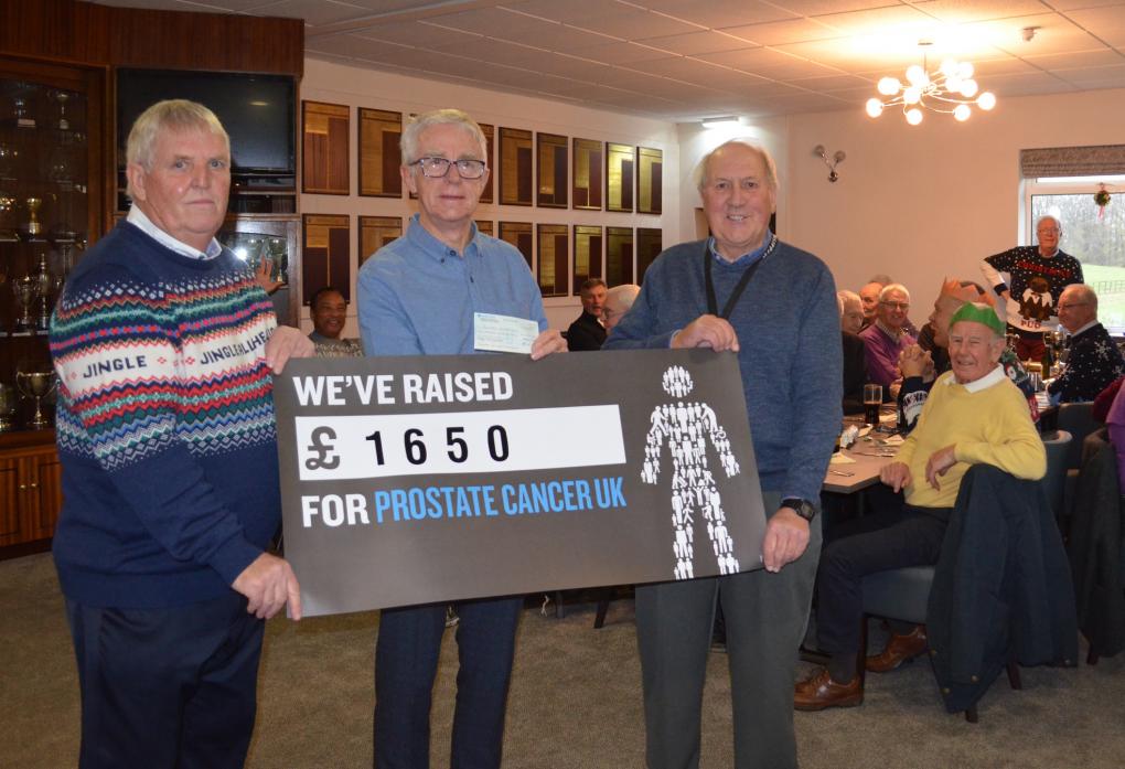 FUNDRAISING EFFORT: Geoff Wall, captain of Barnard Castle Golf Club men’s seniors, left, and club treasurer Peter Holliday hand over a cheque for £1,650 to Robin Millman, representing Prostate Cancer UK