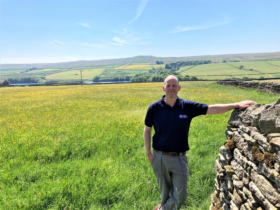 DALE LIFE: Mark Dinning, head of conservation at Durham Wildlife Trust, with Hannah’s meadow behind