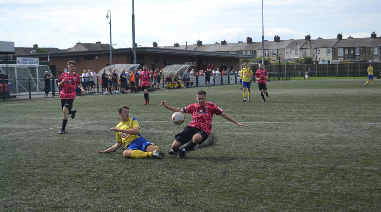 Rob West, left, in action against Consett AFC Reserves        TM pic