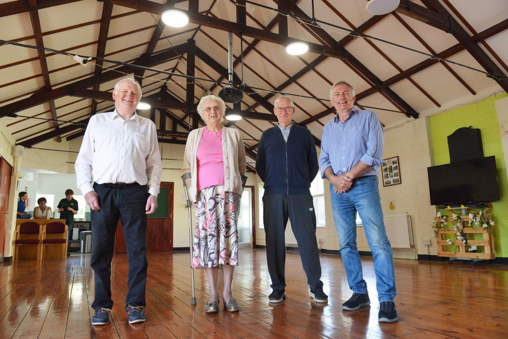 ROOF RAISING:  Cllr George Richardson, village hall member Marian Lewis, chairman Graham Dodd, and county Cllr James Rowlandson celebrate the brighter and warmer ceiling and rafters at Hutton Magna Village Hall TM pic