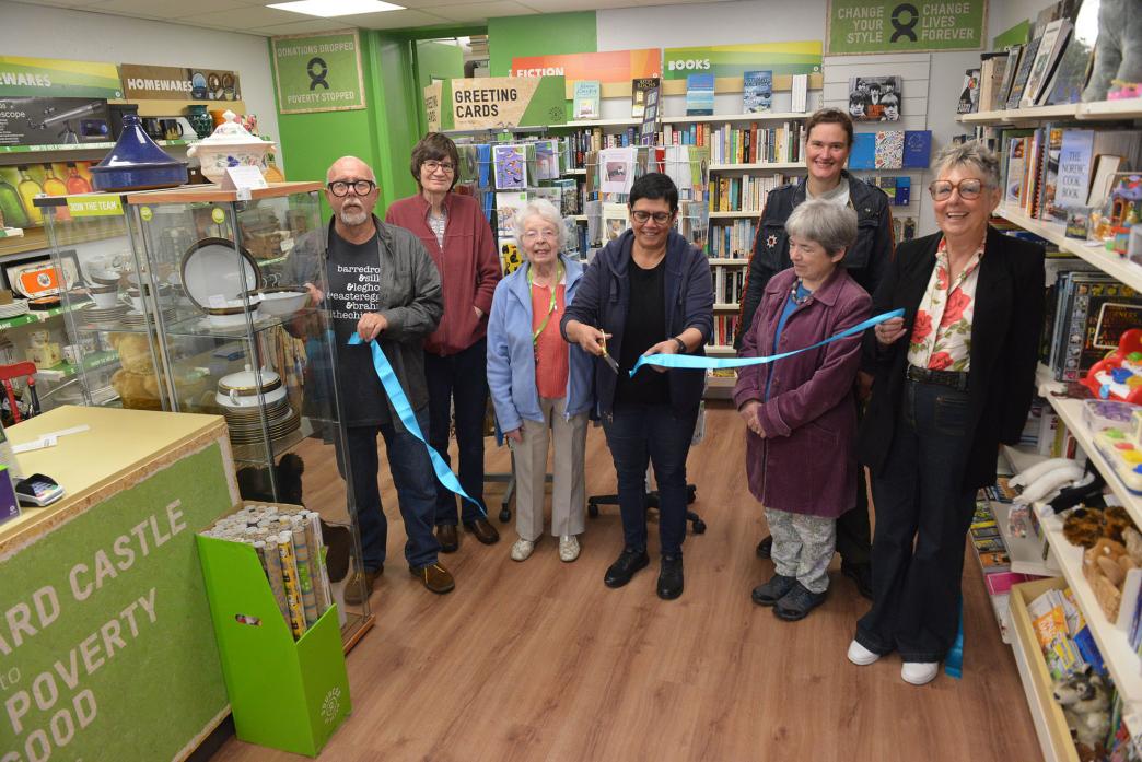 BACK IN BUSINESS: Manager Naila Laundy cuts the ribbon to open the revamped Oxfam shop while Leigh Stenson, Sue Moorhouse, Anne Bell, Heather Coustick, Caroline Cellier and Melanie Stenson look on TM pic