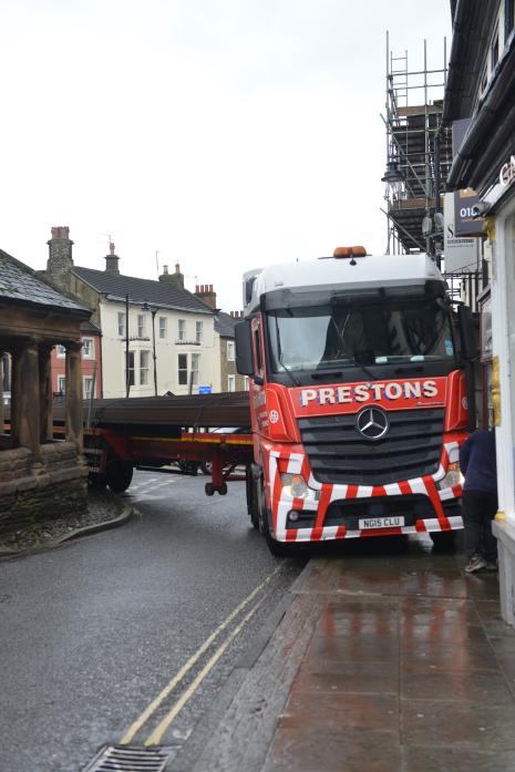 WITH A LITTLE HELP: Left, the oversized HGV caused traffic to come to a standstill in Barnard Castle when it got wedged trying to go round the Market Cross