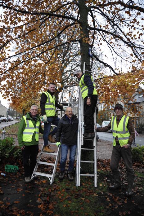 STEPPING UP: Barney’s Christmas Lights Group putting finishing touches to Galgate Green displays before the big switch on next month TM pic