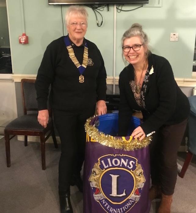 MAKING THE DRAW: Andrea Hobbs of the Teesdale Day Clubs, draws the winners in the presence of Lion's Club president Barbara Foster