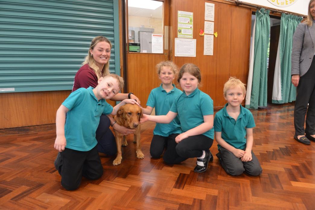 NO MESSING ABOUT: Anti-dog fouling campaigner Evie Hole-Todd with pet Bella and pupils Harvey, Charlotte, Jessica and Lachlan  					              TM pic