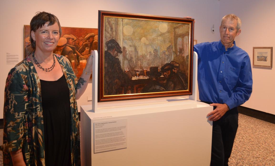 EXHIBITION OPENING: Bowes Museum executive director Hannah Fox with John Cornish and one of his father’s paintings of bar room scene at the opening of the museum’s exhbition Kith and Kinship: Norman Cornish and LS Lowry 			    TM Pics