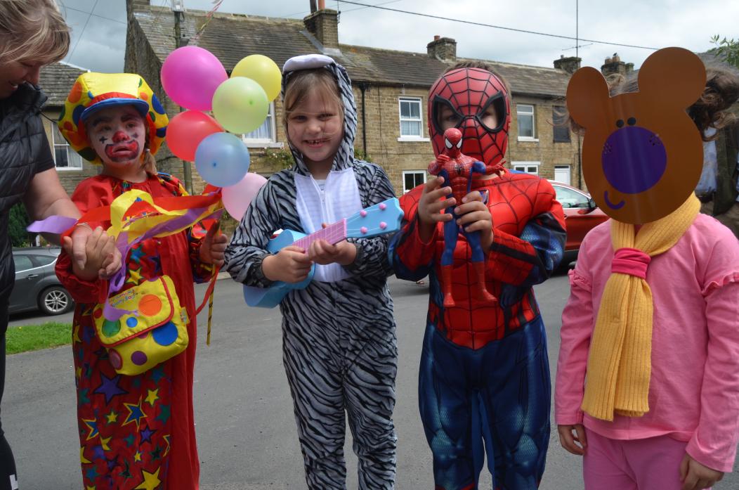 FANCY THAT: Annabelle Toulson, Sofia Chandler, Harold Lamb and Heather Dunn have fun together at the start of the fancy-dress parade at Cotherstone fun weekend