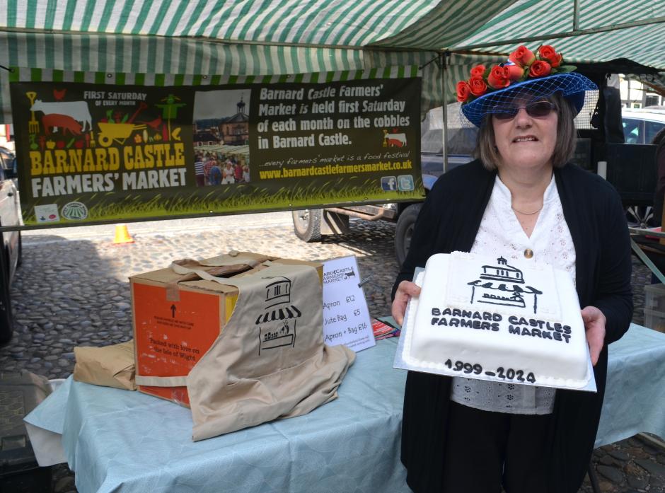 MANY HAPPY RETURNS: Alison Sayer was one of the original stall holders back in 1999 and baked a cake to celebrate 25 years of Barnard Castle Farmers’ Market