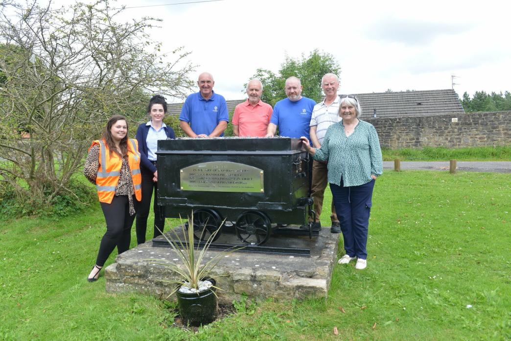 GOOD AS NEW: Roselle Cox, Emma McCutcheon, Laurie Brown, Graeme Lamb, Bryan Hammond, Brian Carter and Jackie Dodds with the refurbished Randolph coal tub