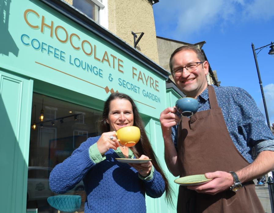 RAISING A CUP: Kenny Walker and wife Sarah Wall raise a cup of coffee to the success of their new lounge