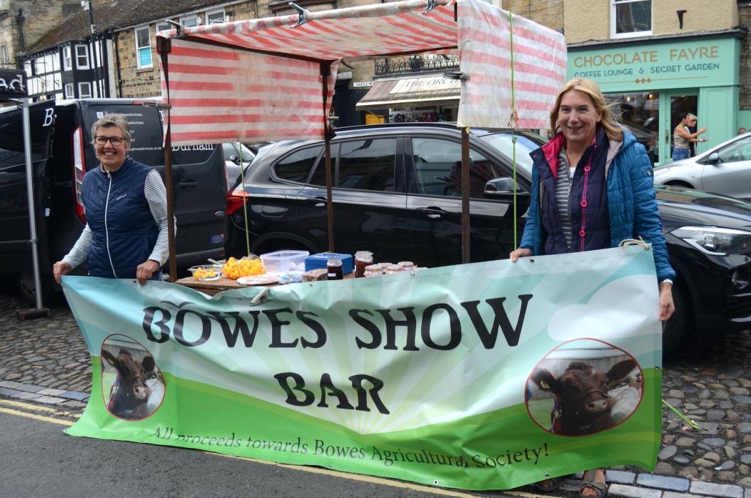 ALMOST SHOWTIME: Bowes Show committee members Sheila Walker and Lynn Todhunter did a roaring trade on Barney’s weekly market promoting this year’s Bowes Show TM pic