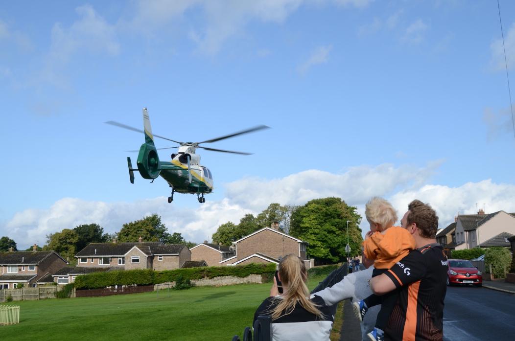 FLYING VISIT: Onlookers watch as the Great North Air Ambulance helicopter takes off from Green Lane Play Area, in Barnard Castle