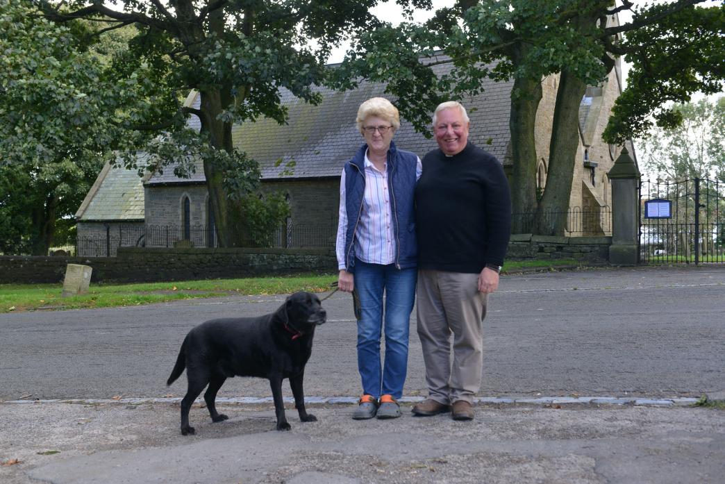 STEPPING DOWN: Retiring vicar Revd Brian Whitley, his wife Brenda and faithful companion George 		   TM pic