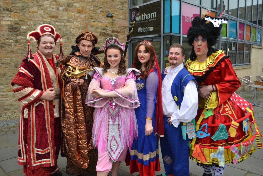 CHRISTMAS FUN: Members of the cast of Aladdin, including regulars of the Barney show Eleanor Alderson, centre, as Spirit of the Ring, and Phil Hoyles, right, as Widow Twanky 									         TM pic