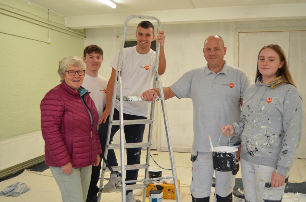 LICK OF PAINT: Clare Trevett, chairwoman of St Mary’s Parish Hall Association with Daniel Carney, Michael Rammage, Charlie Wright and Cameron Southworth, from Trades4Care       TM pic