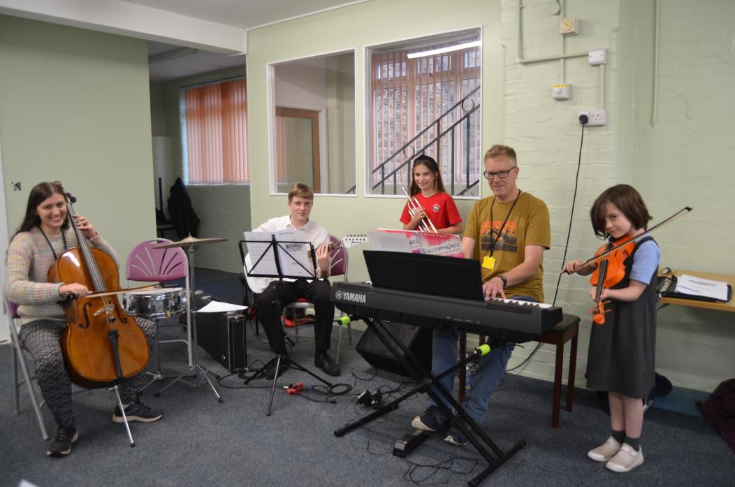 IN THE PINK: The Panthers youth orchestra group met for their first practice session at St Mary’s Parish Hall. Peter Lovatt, at the keyboard, with Emma Piercy-Mycock, Ben Lovatt, Evie Russ-Griffiths and Corinne Drew. Participation is free