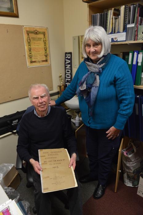 HANDS-ON: Brian Carter and Jackie Dodds with a leaflet of the auction of the Gordon Estate.