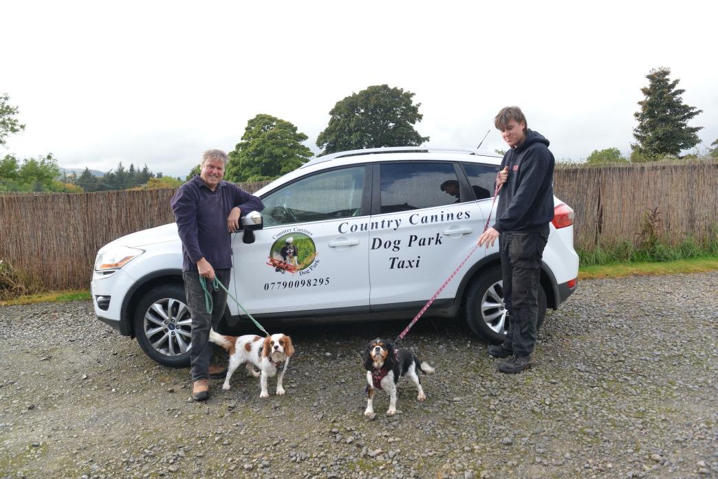 HITTING THE ROAD: Steve and Dan Dean with their new taxi, which will ferry dogs to their canine park, and pet pooches Mabel and Dotty  				              TM pic