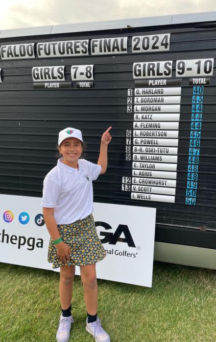 CALIFORNIA BOUND: Olivia Harland points to her winning score at The Belfry.