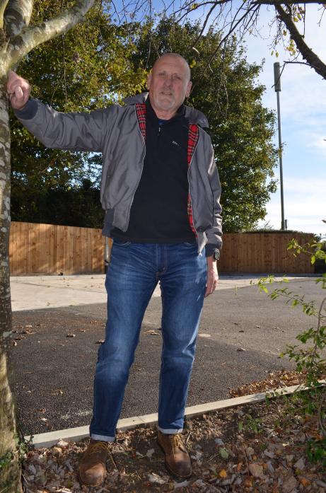 PARKING PROBLEM: Bob Bowman, whose garden fronts on the forecourt,  is one of the residents affected by the new jet wash which was installed without planning permission at Penny Petroleum