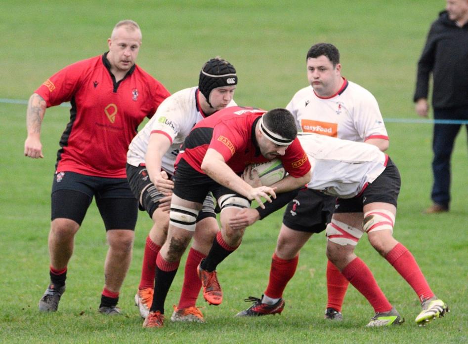 MAKING THEIR POINT: Action from the game against Hartlepool Rovers, which saw Barney secure a bonus point win Pics: Chris Morse