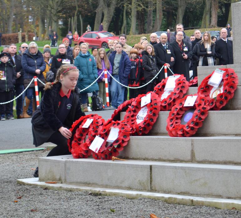 LEST WE FORGET: Communities across the dale paused to remember the fallen as Armistice Day was observed. Pictured is Harriet Richardson laying a wreath on behalf of Montalbo Primary School at the war memorial in the grounds of The Bowes Museum, Barnard Ca