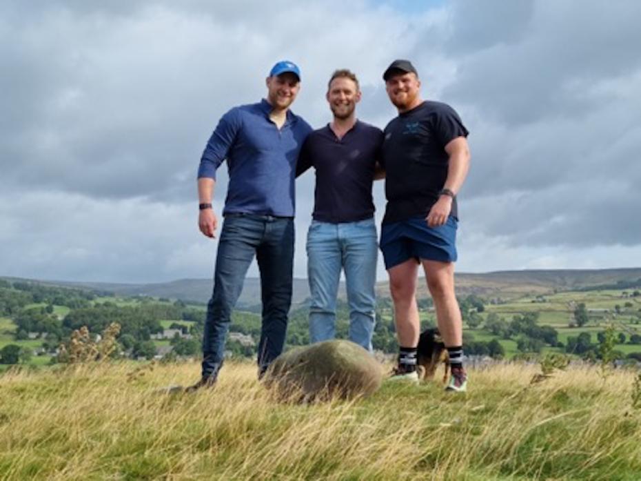 TEST OF STRENGTH: Stone-lifters Calum Stott, centre, with Harry Reeve and Jono Pritchard with the Teesdale Feat Stone.