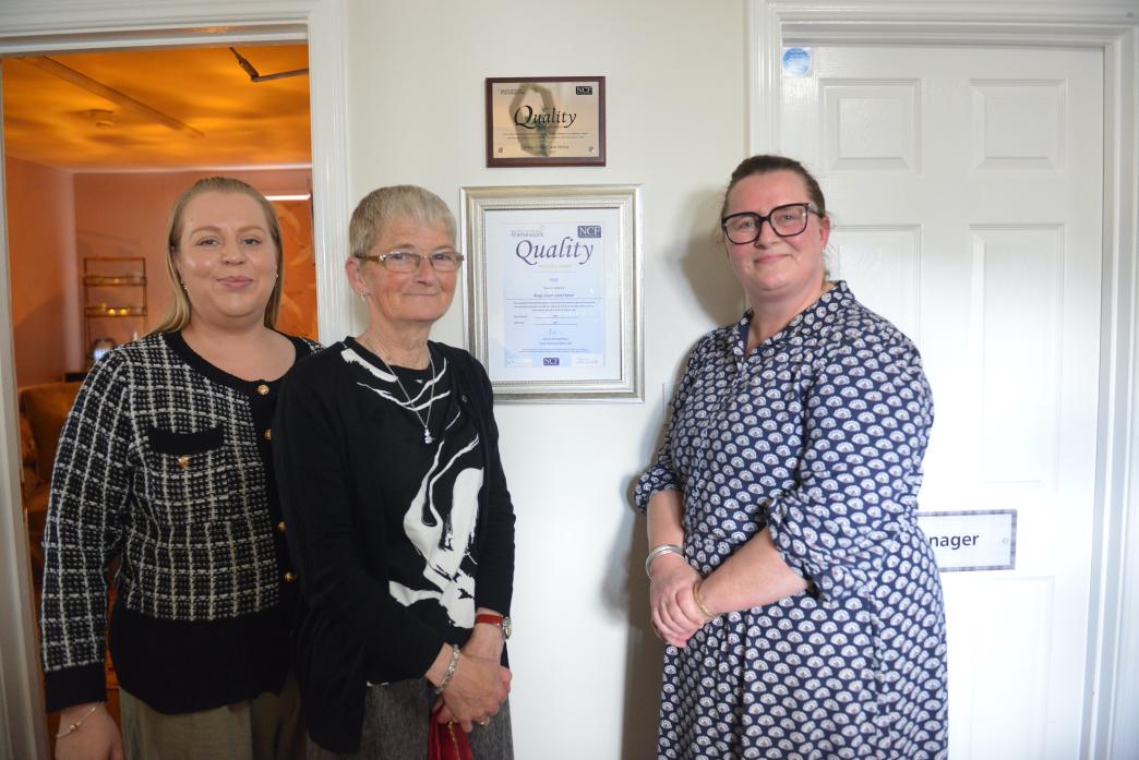 GOLD STANDARD: Manager Hayley Coatsworth, retired manager Mitch Lloyd and deputy manager Jules Coulthard at the unveiling of the Gold Standard Framework award at King’s Court Care Home  								             TM pic