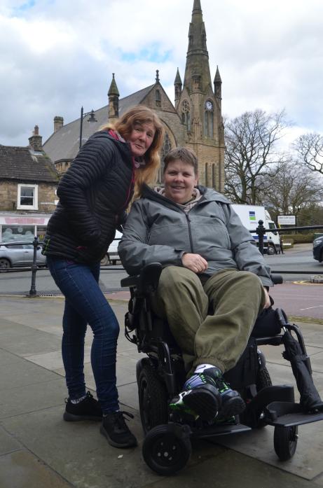 NEARLY THERE: Suzanne Thomas hopes to reach the target for disabled Scout leader Sue Baillie’s new wheelchair by Christmas					    TM pic