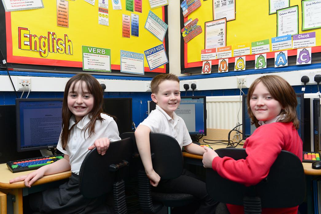 WORDSMITHS: Nine-year-olds Letitia, Ben and Alfie set about writing the 500 Words competition entry