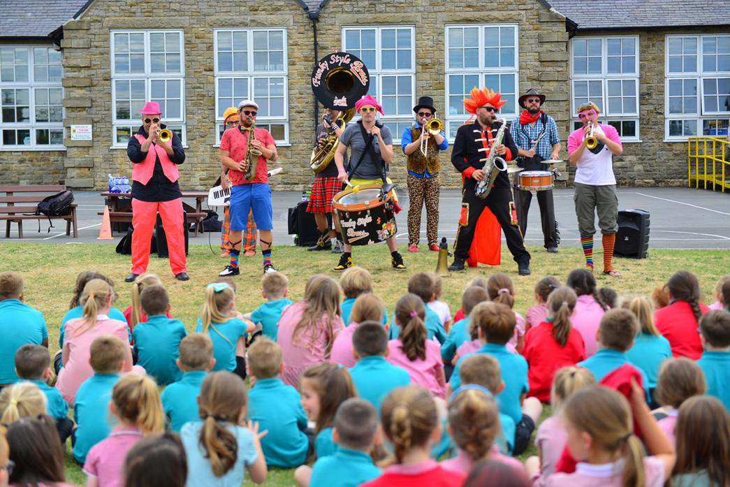 BRILLIANT BRASS: Above, Funky Style Brass, from France, entertain children at Toft Hill Primary School