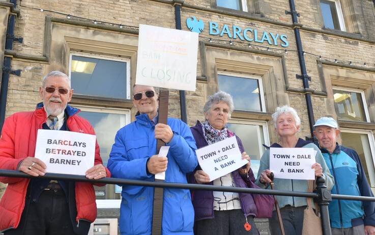 Protesters ‘mourn’ loss of last bank branch