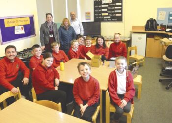TOP GEAR: Headteacher Nicky Wright, Edge Hotel landlady Fiona Coastworth and Amit Kumar, from Cummins, with the year 5 group